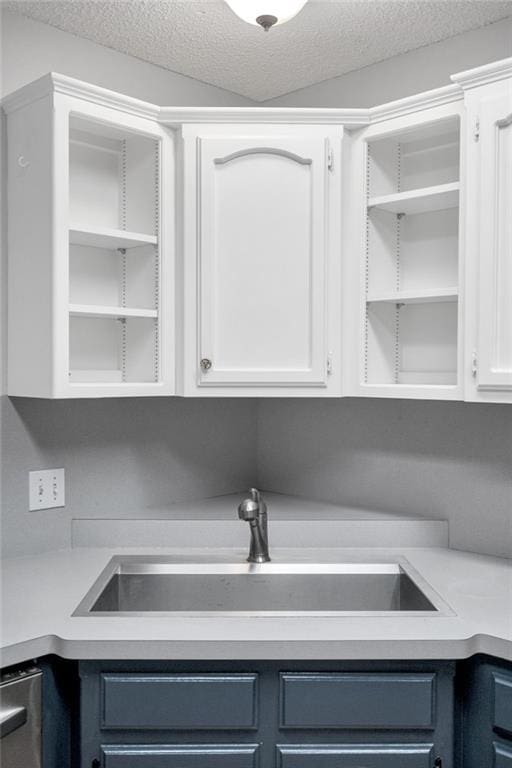 3737 James Victor Dr, Baton Rouge, LA 70817 - clothes washing area featuring a sink and a textured ceiling