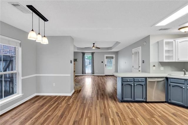 3737 James Victor Dr, Baton Rouge, LA 70817 - kitchen with dishwasher, open shelves, a peninsula, and wood finished floors