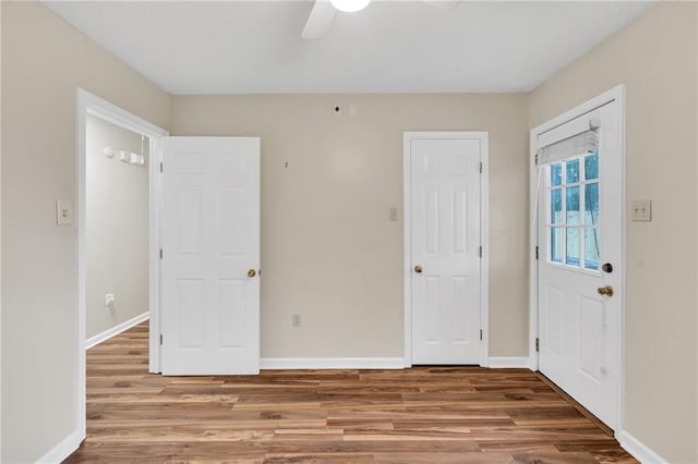 3737 James Victor Dr, Baton Rouge, LA 70817 - unfurnished bedroom featuring wood finished floors, baseboards, and ceiling fan