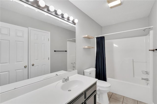 3737 James Victor Dr, Baton Rouge, LA 70817 - bathroom with toilet, tile patterned flooring, shower / bath combo, vanity, and a textured ceiling