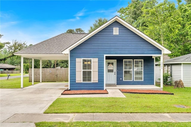 3986 Main St, Zachary, LA 70791 - view of front of house featuring covered porch, driveway, and a carport