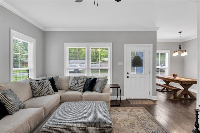 3986 Main St, Zachary, LA 70791 - living room with healthy amount of natural light, hardwood / wood-style flooring, a ceiling fan, ornamental molding, and baseboards