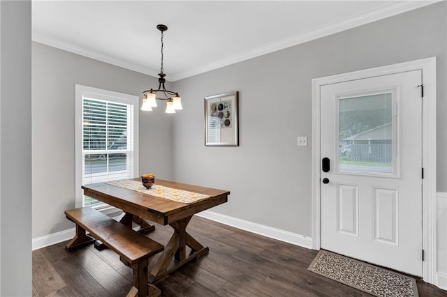 3986 Main St, Zachary, LA 70791 - dining area featuring a chandelier, dark wood-style flooring, baseboards, and ornamental molding