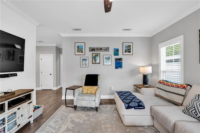 3986 Main St, Zachary, LA 70791 - living area with ornamental molding, wood finished floors, and baseboards