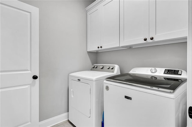 3986 Main St, Zachary, LA 70791 - washroom with washer and clothes dryer, cabinet space, and baseboards