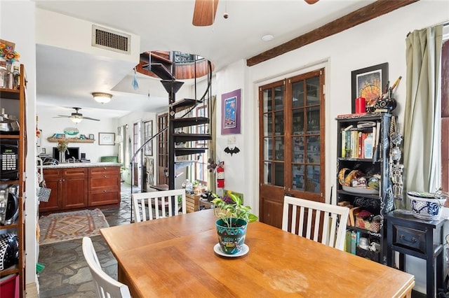 121214 Royal St, New Orleans, LA 70116 - dining space featuring a ceiling fan and stairs