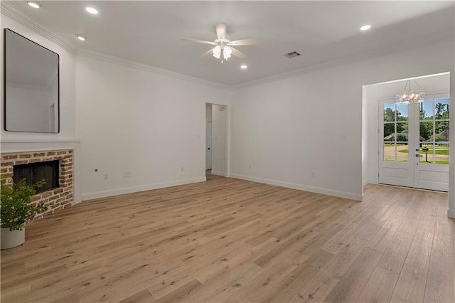 212 Highland Oak N, Madisonville, LA 70447 - unfurnished living room featuring crown molding, light wood finished floors, ceiling fan, a chandelier, and baseboards
