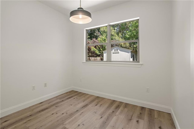 212 Highland Oak N, Madisonville, LA 70447 - unfurnished room with baseboards and light wood-type flooring