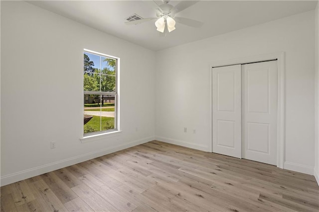 212 Highland Oak N, Madisonville, LA 70447 - unfurnished bedroom with light wood-type flooring, baseboards, and a closet