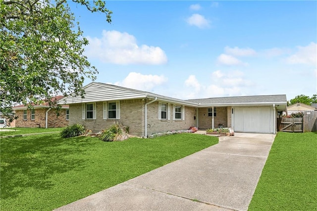 ranch-style house with driveway and brick siding