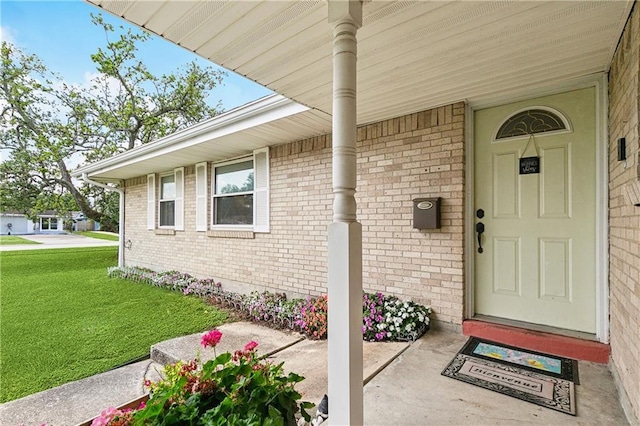 6417 Kawanee Ave, Metairie, LA 70003 - entrance to property featuring covered porch, a lawn, and brick siding
