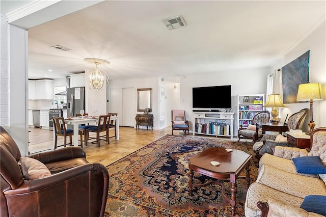 living area featuring a chandelier