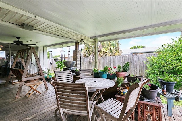 6417 Kawanee Ave, Metairie, LA 70003 - deck with outdoor dining space, a ceiling fan, and a fenced backyard