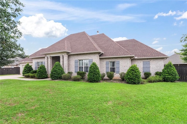 336 Rue St, Emilion, Covington, LA 70433 - view of front of property featuring brick siding, a garage, roof with shingles, and concrete driveway