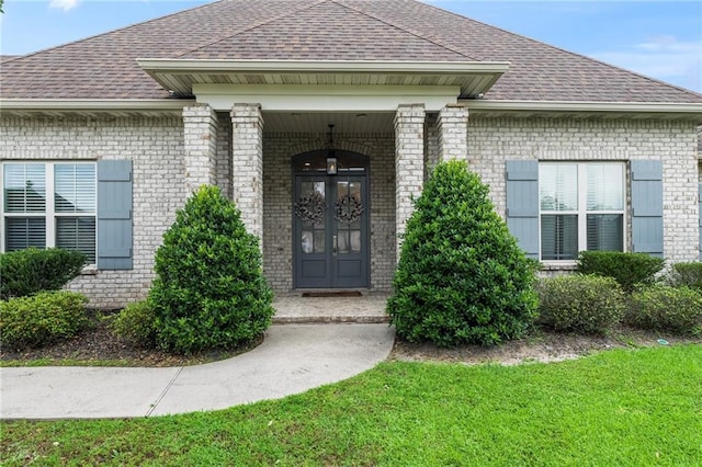 336 Rue St, Emilion, Covington, LA 70433 - entrance to property featuring roof with shingles, brick siding, and a lawn