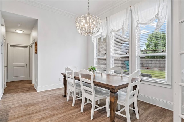 336 Rue St, Emilion, Covington, LA 70433 - dining space featuring a chandelier, baseboards, light wood finished floors, and crown molding