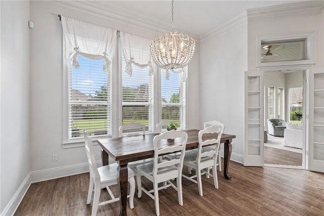 336 Rue St, Emilion, Covington, LA 70433 - dining area featuring healthy amount of natural light, baseboards, a chandelier, wood finished floors, and ornamental molding