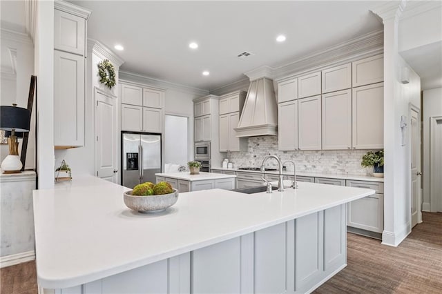 336 Rue St, Emilion, Covington, LA 70433 - kitchen with stainless steel appliances, a sink, a kitchen island with sink, backsplash, and recessed lighting
