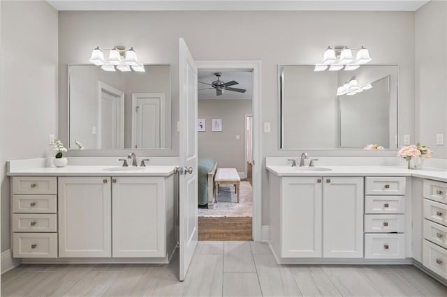 336 Rue St, Emilion, Covington, LA 70433 - bathroom with two vanities, ceiling fan, and baseboards