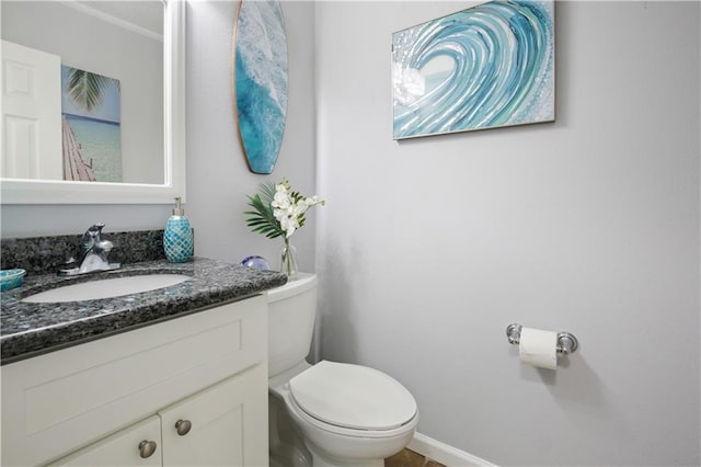 126 Silverwood Dr, Slidell, LA 70461 - bathroom featuring toilet, vanity, and baseboards