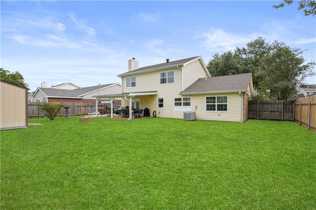 126 Silverwood Dr, Slidell, LA 70461 - back of house with central AC, a patio area, and a chimney
