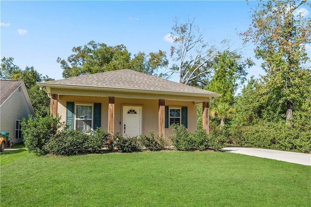 200 Cotton Ln, Hammond, LA 70401 - bungalow-style house with a front lawn, stucco siding, and roof with shingles