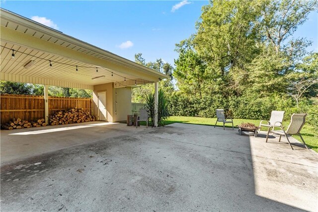 200 Cotton Ln, Hammond, LA 70401 - view of patio / terrace with a fire pit and fence