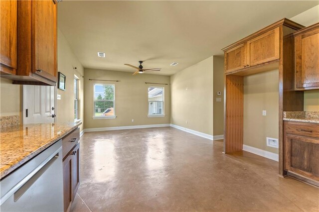 200 Cotton Ln, Hammond, LA 70401 - kitchen featuring stainless steel dishwasher, brown cabinets, concrete flooring, a ceiling fan, and baseboards