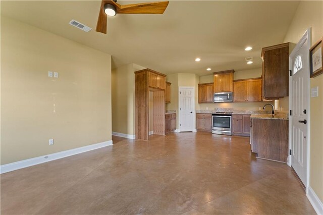 200 Cotton Ln, Hammond, LA 70401 - kitchen featuring appliances with stainless steel finishes, baseboards, a ceiling fan, finished concrete floors, and recessed lighting