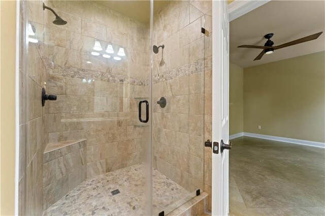200 Cotton Ln, Hammond, LA 70401 - bathroom with a shower stall, ceiling fan, baseboards, and concrete floors