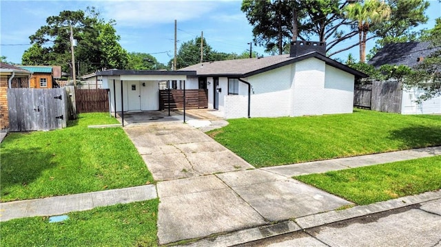 778 Heritage Ave, Gretna, LA 70056 - single story home featuring driveway, brick siding, a chimney, and a carport
