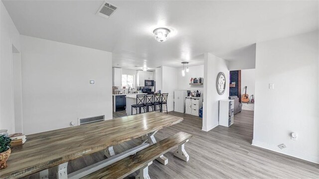778 Heritage Ave, Gretna, LA 70056 - dining area with light wood-style floors and baseboards