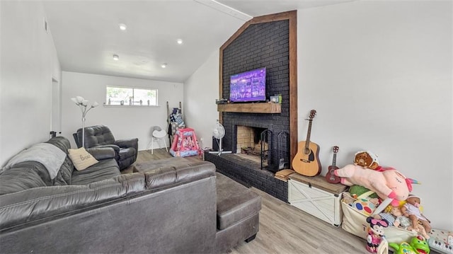778 Heritage Ave, Gretna, LA 70056 - living room featuring wood finished floors, vaulted ceiling, and a fireplace