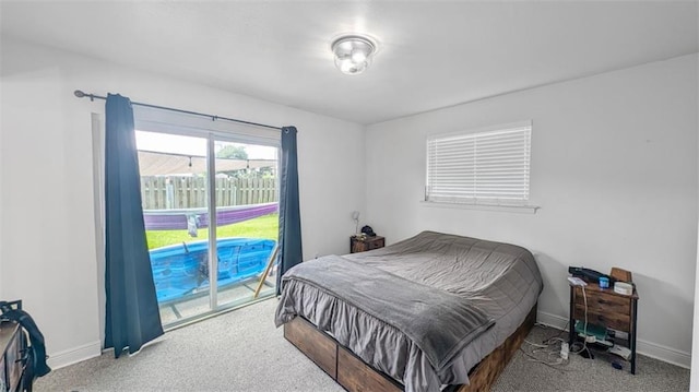 778 Heritage Ave, Gretna, LA 70056 - bedroom with carpet flooring, access to exterior, and baseboards