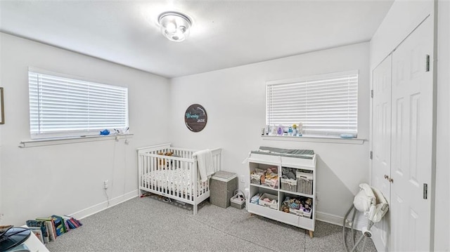 778 Heritage Ave, Gretna, LA 70056 - bedroom featuring carpet floors, baseboards, a closet, and a nursery area