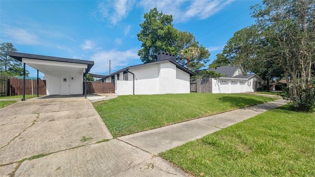 778 Heritage Ave, Gretna, LA 70056 - view of yard with driveway and a carport