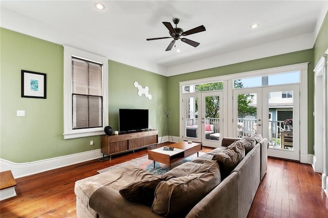 living area with baseboards, a ceiling fan, french doors, hardwood / wood-style floors, and recessed lighting