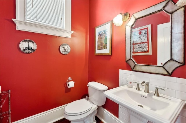 5925 Annunciation St, New Orleans, LA 70115 - bathroom with a sink and decorative backsplash