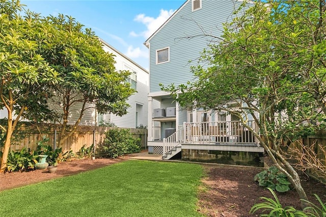view of yard featuring stairs and a wooden deck