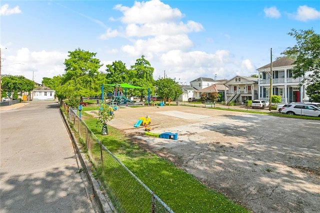 view of concrete road featuring a residential view