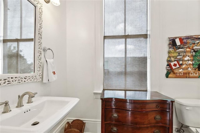 5925 Annunciation St, New Orleans, LA 70115 - half bath with a sink and toilet