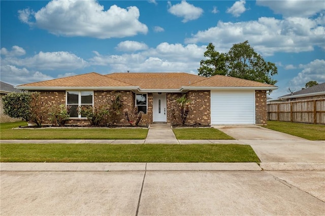 ranch-style home featuring brick siding and concrete driveway