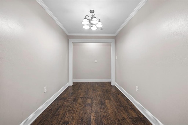doorway to outside featuring a chandelier, wood finished floors, crown molding, and baseboards