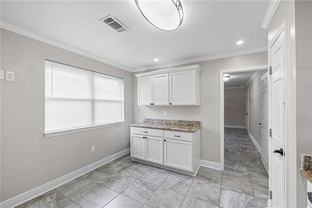kitchen with crown molding, light marble finish flooring, baseboards, white cabinets, and recessed lighting