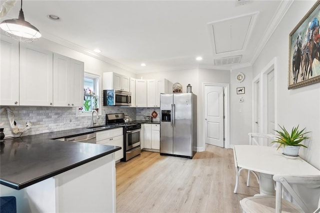 3222 Orleans Ave, New Orleans, LA 70119 - kitchen featuring stainless steel appliances, dark countertops, a sink, backsplash, and ornamental molding