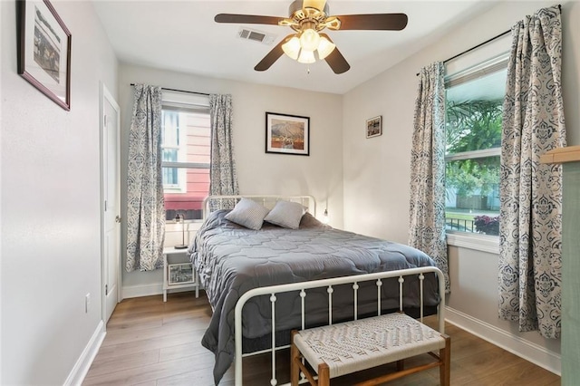 3222 Orleans Ave, New Orleans, LA 70119 - bedroom featuring wood finished floors, baseboards, and ceiling fan
