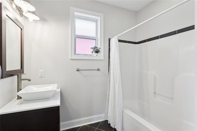 3222 Orleans Ave, New Orleans, LA 70119 - full bathroom featuring baseboards, tile patterned floors, vanity, and shower / bath combo with shower curtain