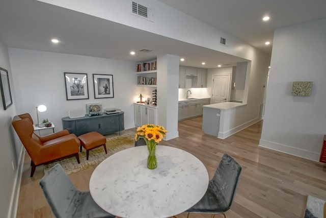1115 Upperline St Unit 1115, New Orleans, LA 70115 - living area with light wood-style flooring, recessed lighting, and baseboards