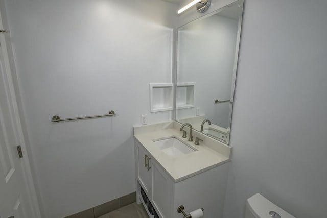 1115 Upperline St Unit 1115, New Orleans, LA 70115 - half bathroom with toilet, vanity, and tile patterned floors