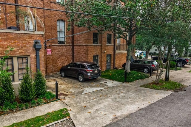 1115 Upperline St Unit 1115, New Orleans, LA 70115 - view of side of home featuring brick siding